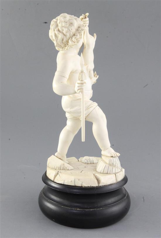 A 19th century Dieppe carved ivory figure of a putto holding a dead deer, height 12in.